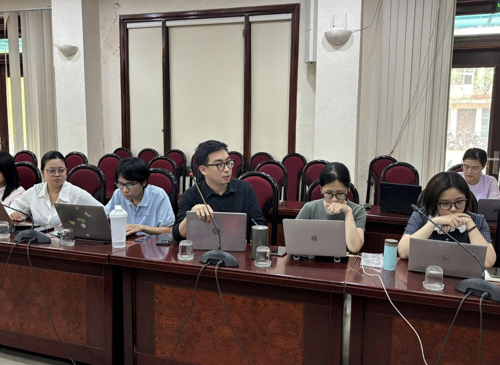 Delegates taking commemorative photographs at the Institute for Human, Family and Gender Studies, Hanoi